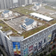 Illustration for article titled Houses built on a shopping mall roof give residents a yard in the middle of the city